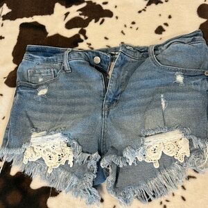 Light washed denim crochet high rise shorts. Size 8/29